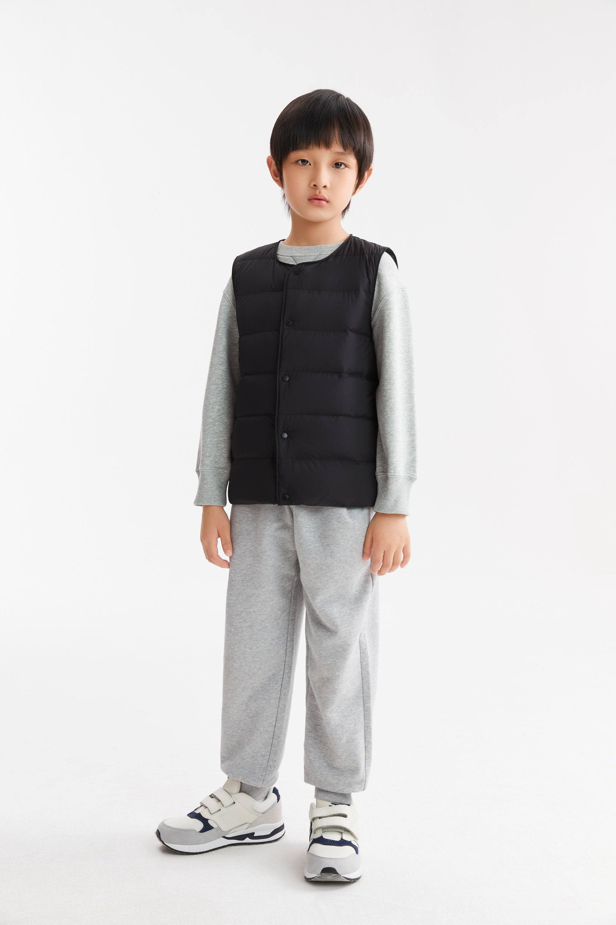 Kid's Ultra-light Down Gilet — Experience ultimate comfort and warmth with our lightweight soft-touch fabric in Black, sizes 3-4 yrs–13-14 yrs; water-resistant