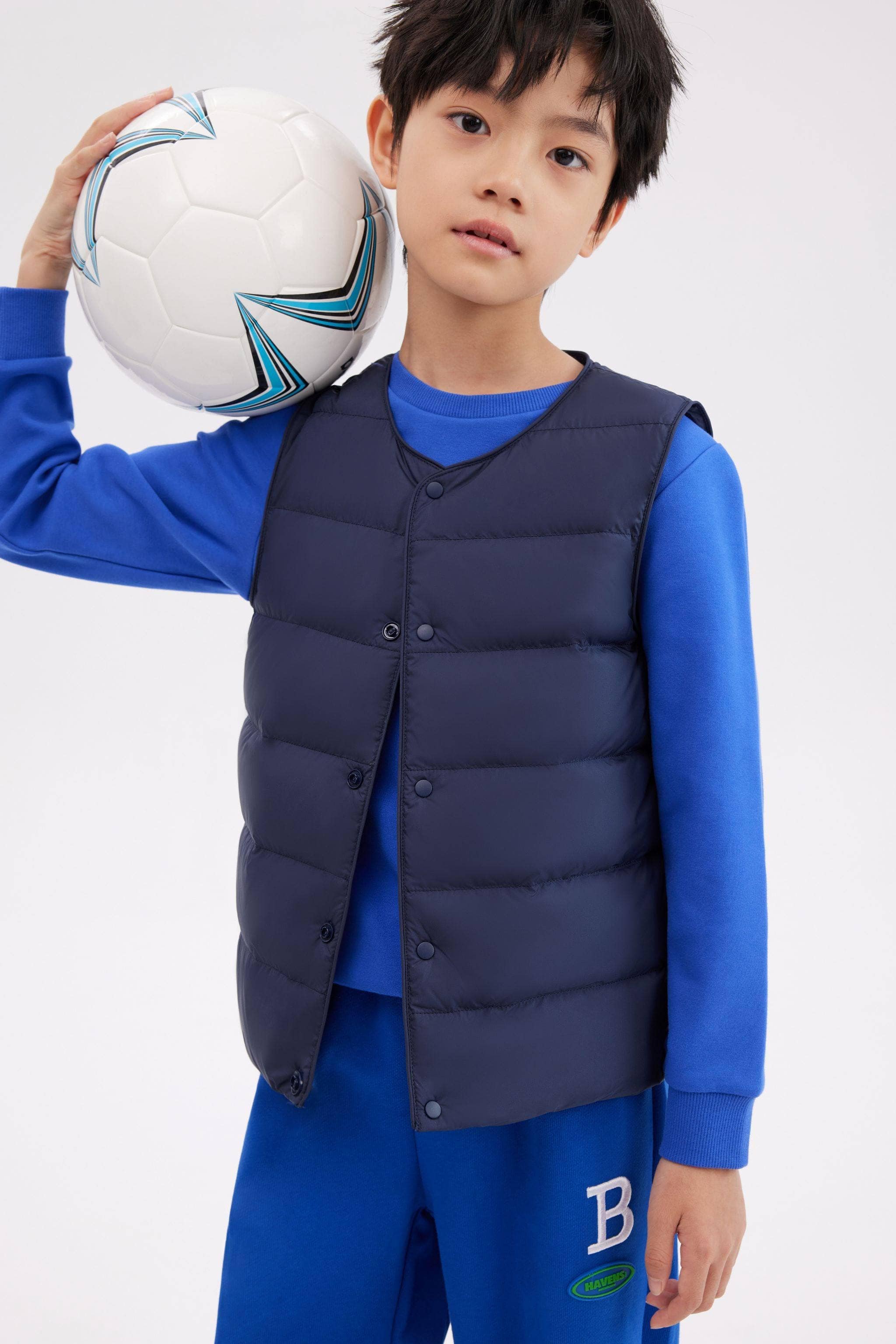 Kid's Ultra-light Down Gilet — Experience ultimate comfort and warmth with our lightweight soft-touch fabric in Navy, sizes 4-5 yrs–11-12 yrs; water-resistant