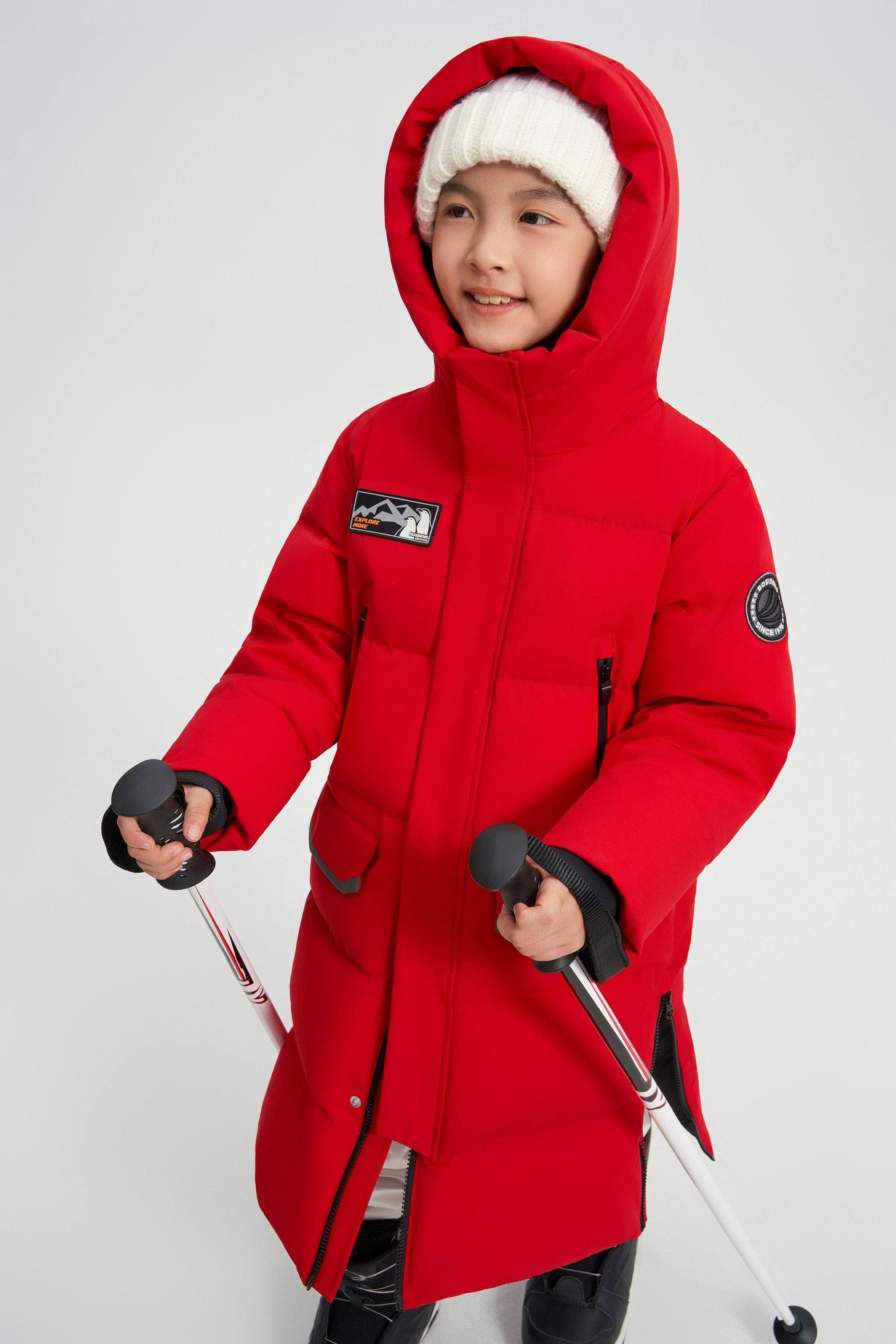 Kid's Classic Extreme Down Coat — The Kid's Classic Extreme Down Coat combines warmth and durability with a timeless in CN Red, sizes 6-7yr–12-13yr; water-resistant, windproof